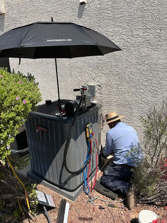 HVAC technician performing outdoor AC maintenance in Starke